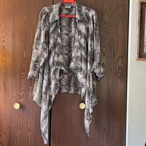Essential black and white sheer sleeved shrug. Size Large.